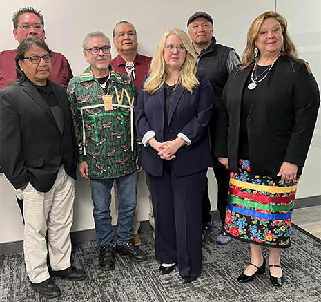 Tribal leaders pose for a portrait with HRSA Administrator Carole Johnson
