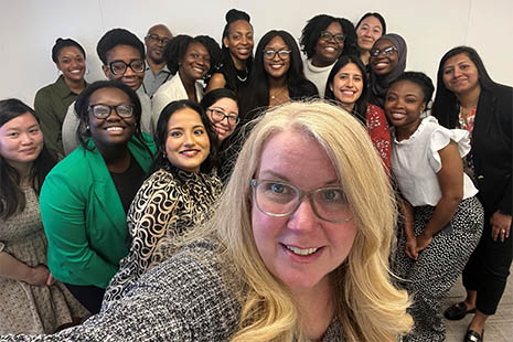 HRSA Administrator Carole Johnson takes a selfie with a group of women