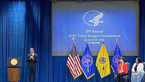 HHS Secretary Xavier Becerra speaks onstage at the 25th Annual HHS Tribal Budget Consultation meeting.