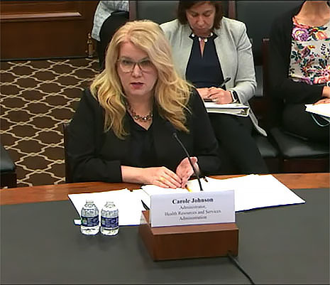 HRSA Administrator Carole Johnson seated at a table while testifying before the House Committee on Energy & Commerce.