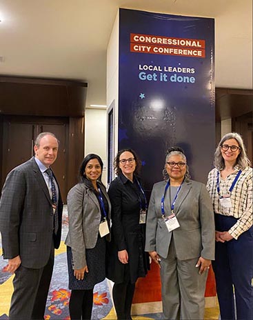 HRSA staff stand together for a portrait while attending the National League of Cities' Congressional City Conference. 