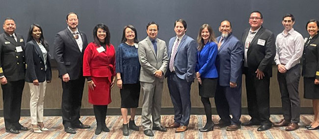 HRSA Deputy Administrator Jordan Grossman and members of the HRSA Tribal Advisory Council stand together for a portrait. 