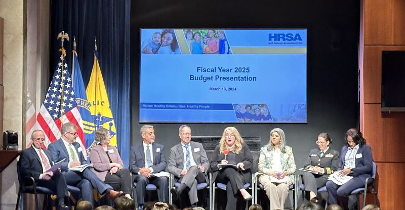 HRSA Administrator Johnson and Bureau/Office leaders seated onstage at HRSA Budget Highlights event.