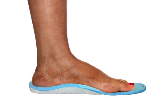 A foot is stepping on top of an orthotic.