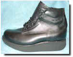 Rigid rocker sole with cowboy heel image.